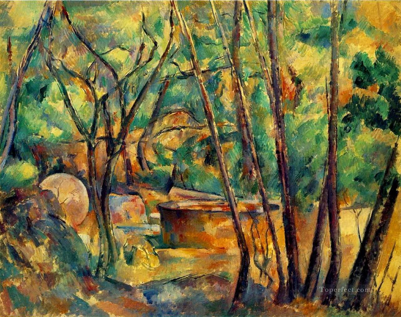 Piedra de molino y cisterna bajo los árboles Bosque de Paul Cezanne Pintura al óleo